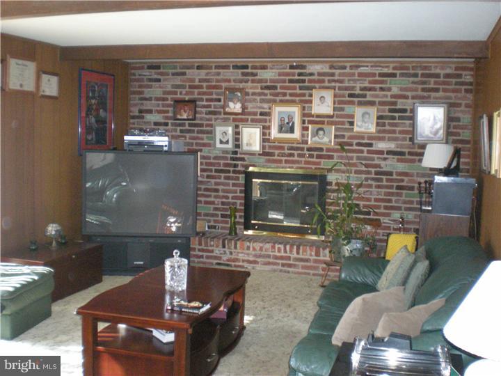 4 Ramsgate Road Cherry Hill, NJ 08003 - Photo 6 of 24 a living room with furniture and a fireplace
