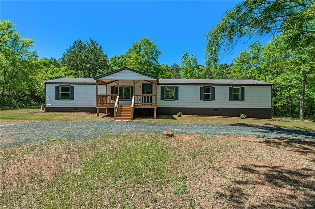 4742 Boxankle Road Barnesville, GA 30204 - Photo 1 of 1 a front view of a house with a yard
