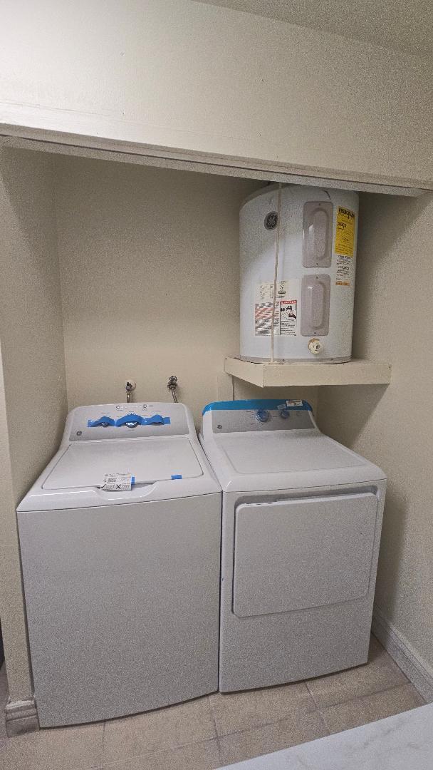 4403 Treehouse Lane, Unit H Tamarac, FL 33319 - Photo 20 of 26 a utility room with dryer and washer