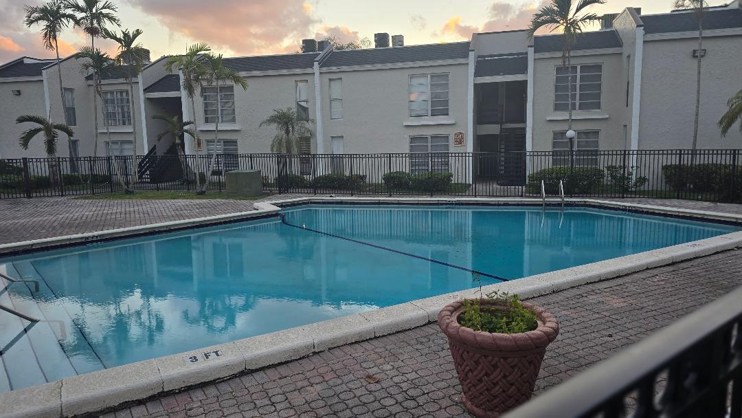 4403 Treehouse Lane, Unit H Tamarac, FL 33319 - Photo 23 of 26 a view of swimming pool with outdoor seating