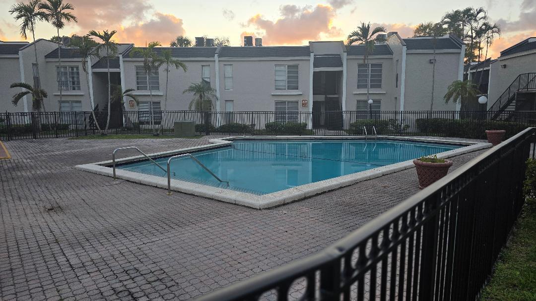 4403 Treehouse Lane, Unit H Tamarac, FL 33319 - Photo 26 of 26 a view of swimming pool with a lounge chairs
