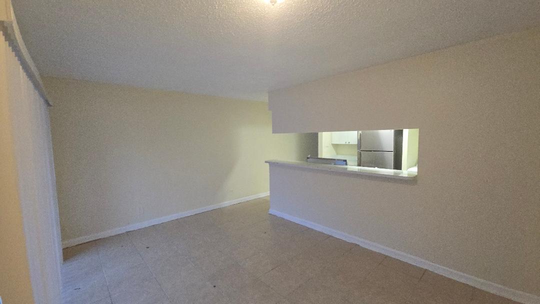 4403 Treehouse Lane, Unit H Tamarac, FL 33319 - Photo 6 of 26 a view of empty room