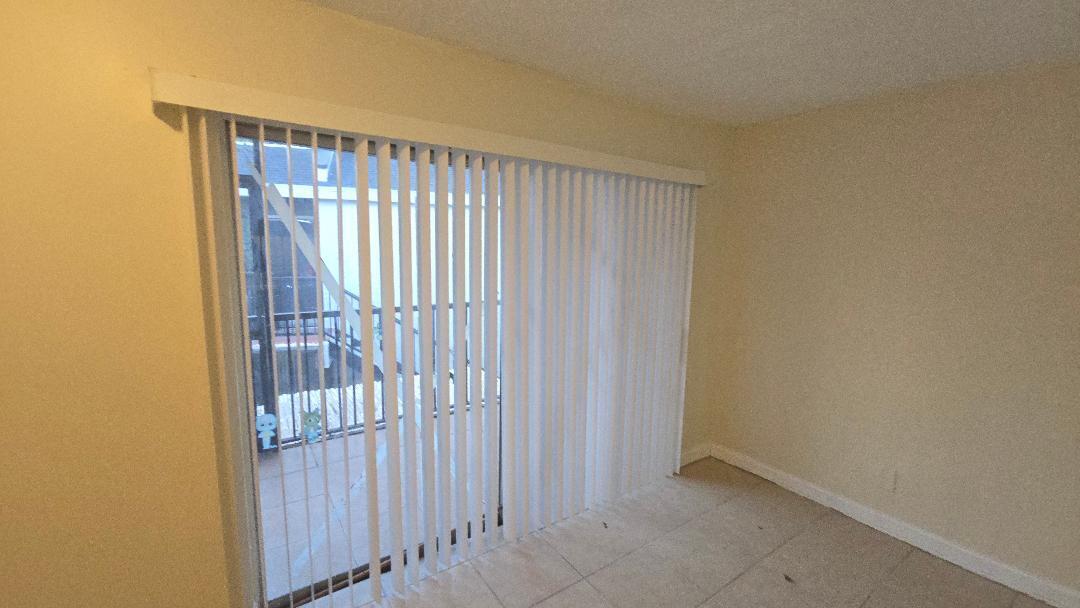 4403 Treehouse Lane, Unit H Tamarac, FL 33319 - Photo 8 of 26 a view of entryway with wooden floor