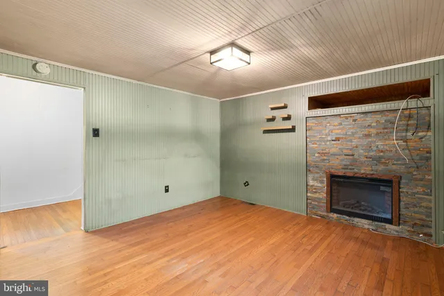 a bedroom with a bed and a fireplace