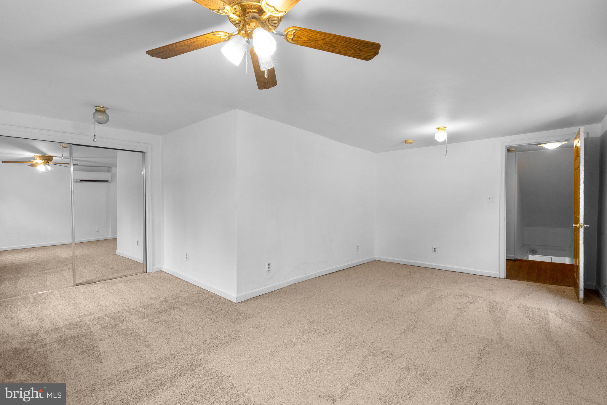 810 Knoxville Road Knoxville, MD 21758 - Photo 31 of 42 an empty room with a chandelier fan and windows