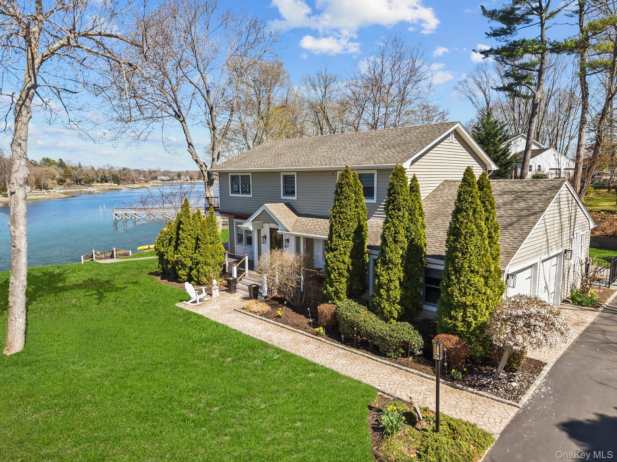 29 Dyke Road Setauket, NY 11733 - Photo 1 of 44 a front view of a house with garden