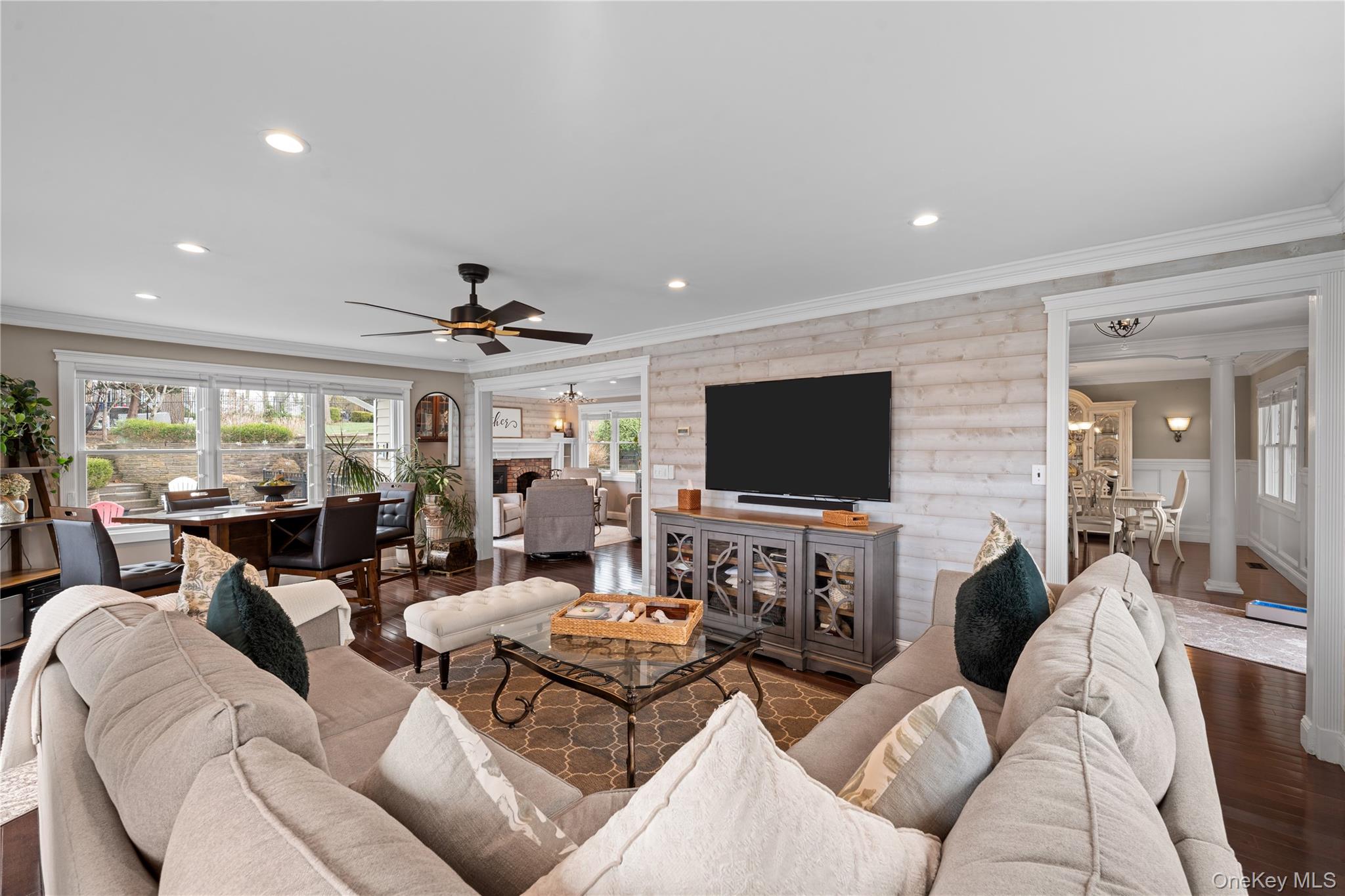 29 Dyke Road Setauket, NY 11733 - Photo 12 of 44 a living room with furniture and a flat screen tv