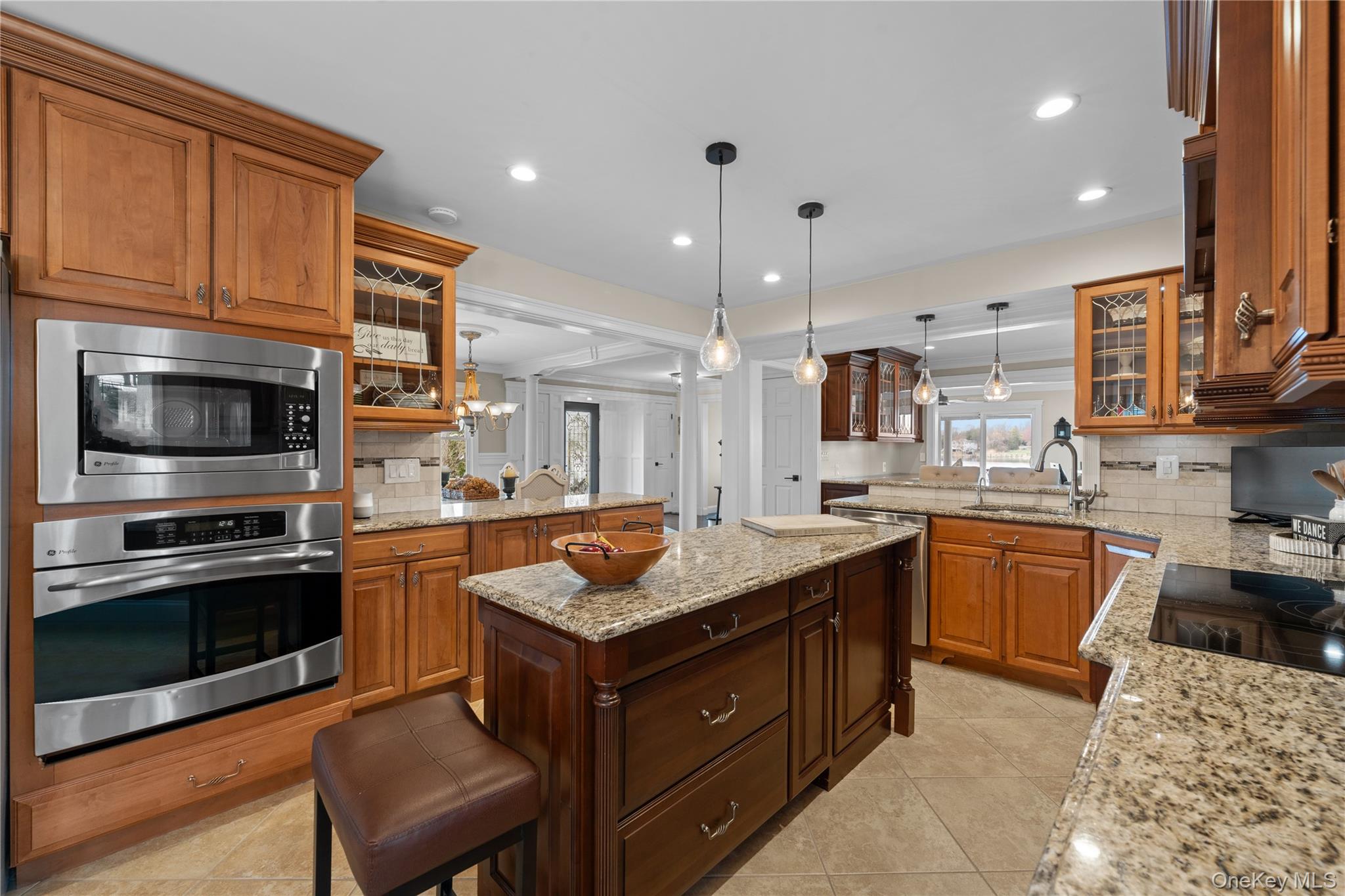 29 Dyke Road Setauket, NY 11733 - Photo 16 of 44 a kitchen with stainless steel appliances granite countertop a sink stove and oven