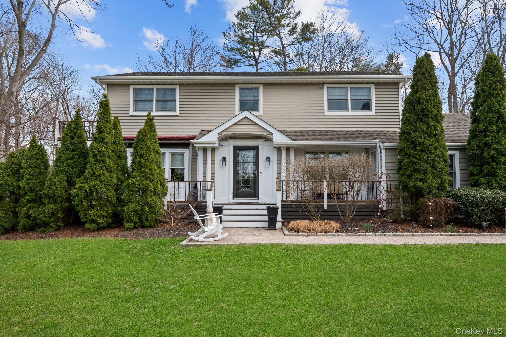 29 Dyke Road Setauket, NY 11733 - Photo 2 of 44 a front view of a house with a yard