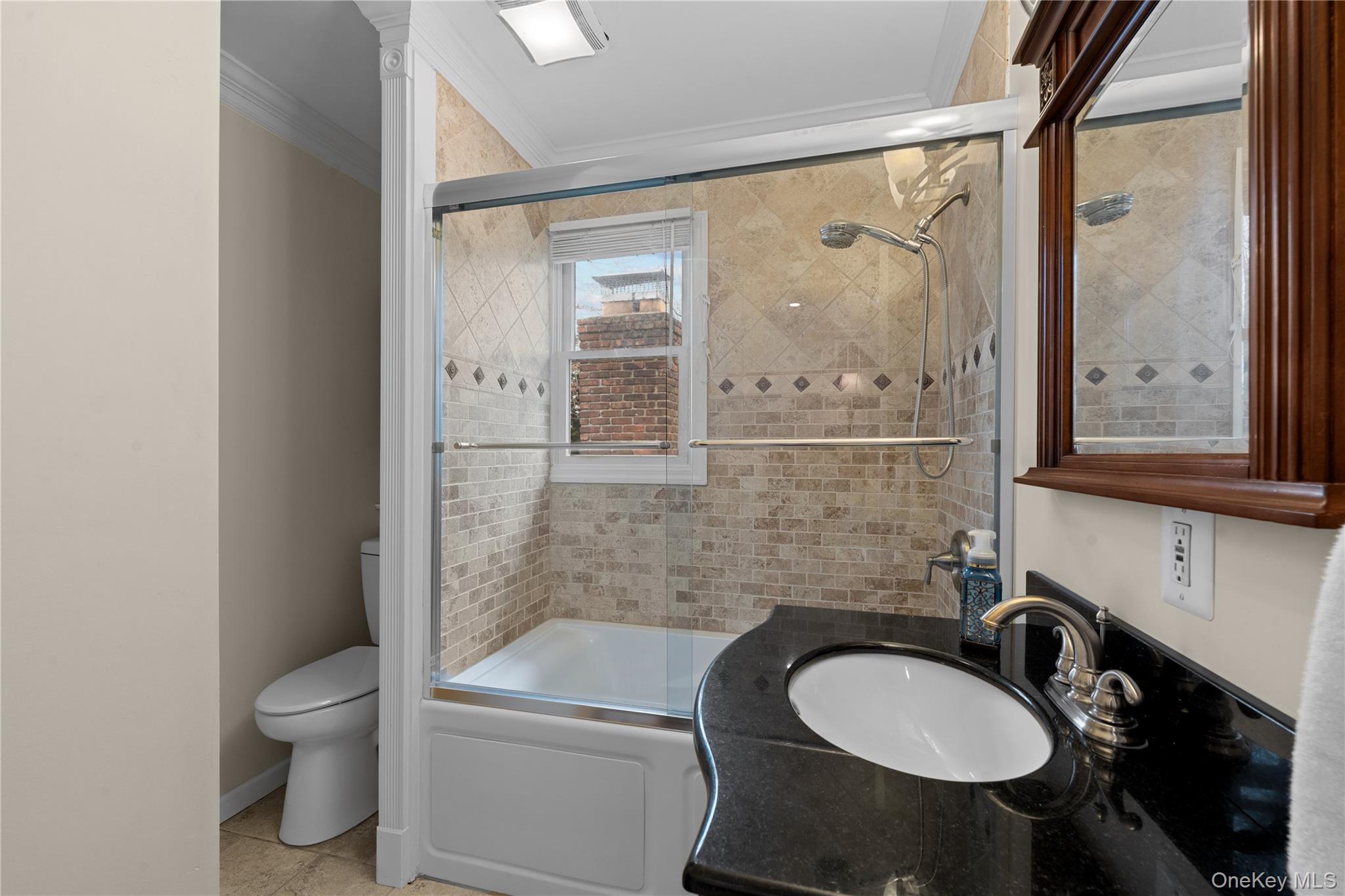 29 Dyke Road Setauket, NY 11733 - Photo 24 of 44 a bathroom with a toilet a sink and mirror