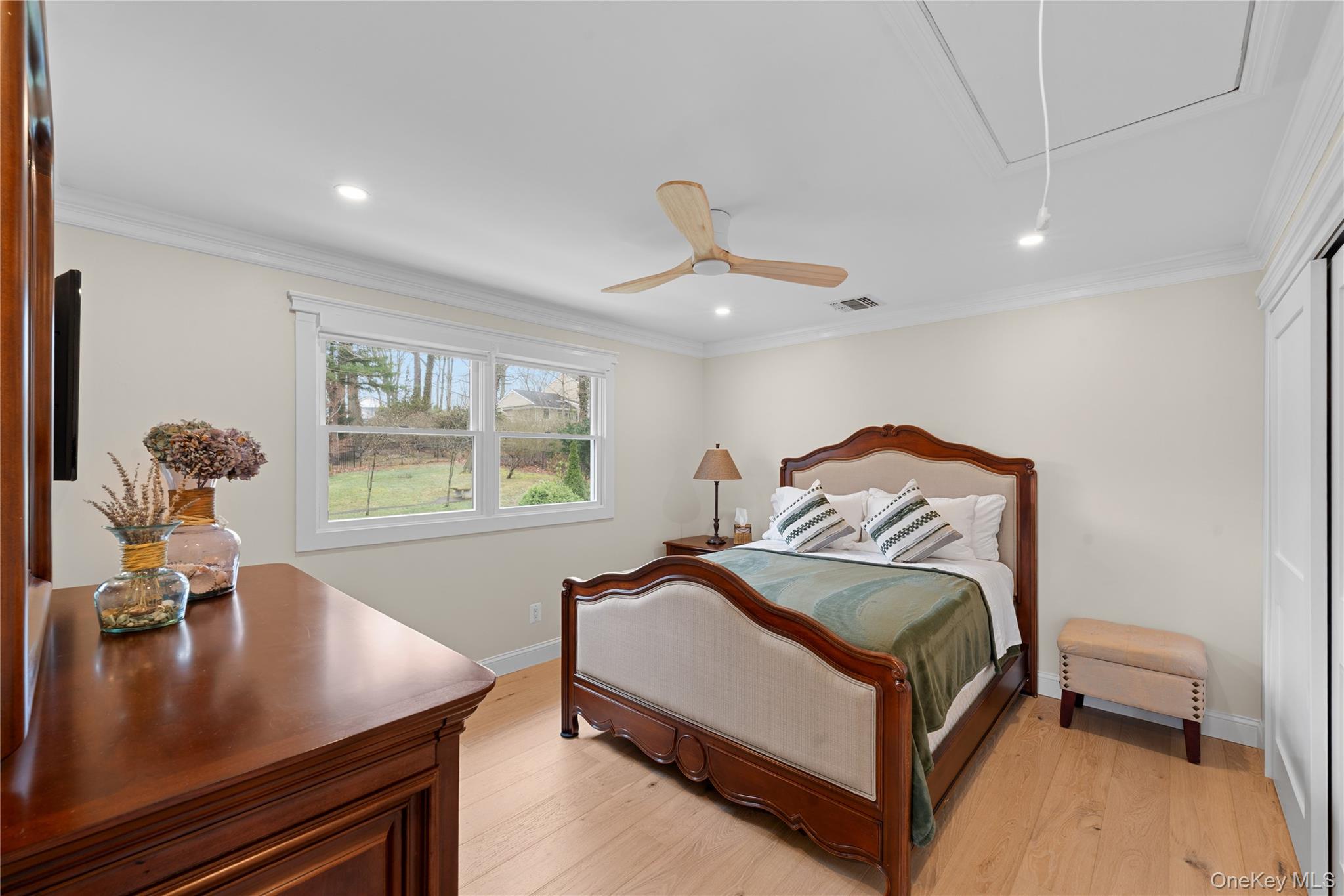 29 Dyke Road Setauket, NY 11733 - Photo 25 of 44 a bedroom with a bed and window