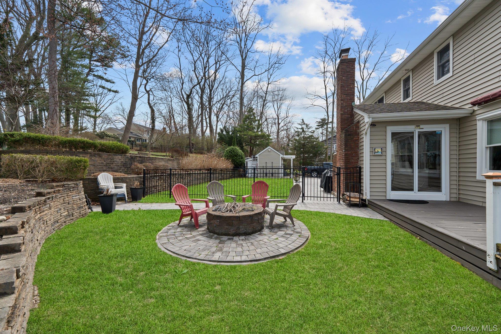 29 Dyke Road Setauket, NY 11733 - Photo 38 of 44 a view of a house with backyard sitting area and swimming pool