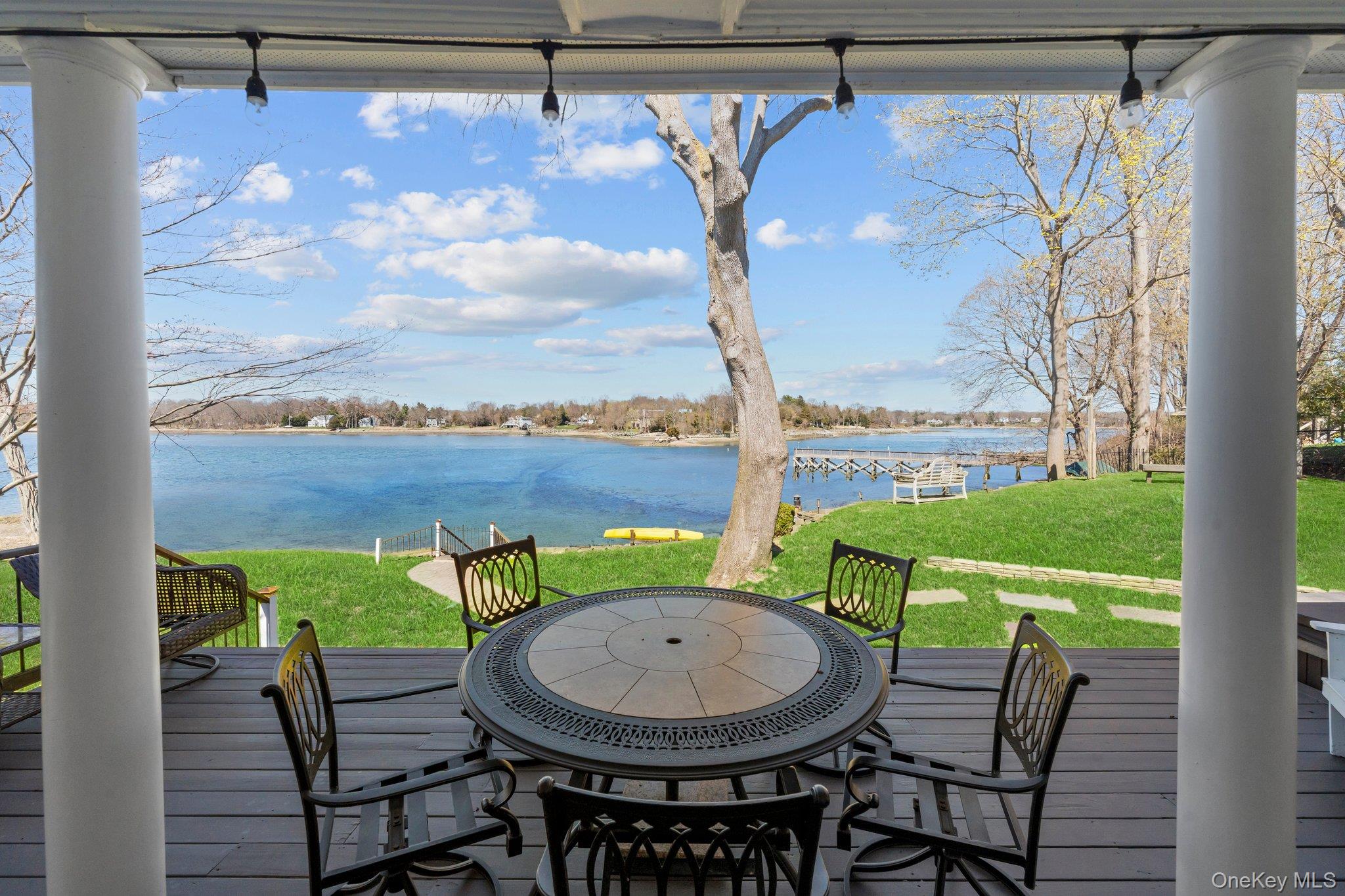 29 Dyke Road Setauket, NY 11733 - Photo 4 of 44 a view of a chairs and table in patio