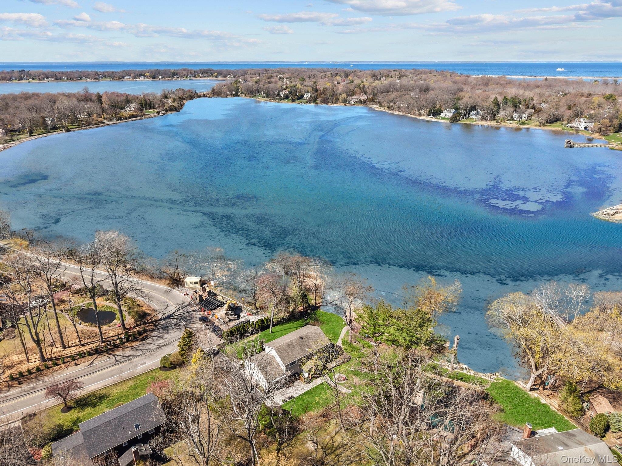 29 Dyke Road Setauket, NY 11733 - Photo 41 of 44 a view of a lake with a building in the background