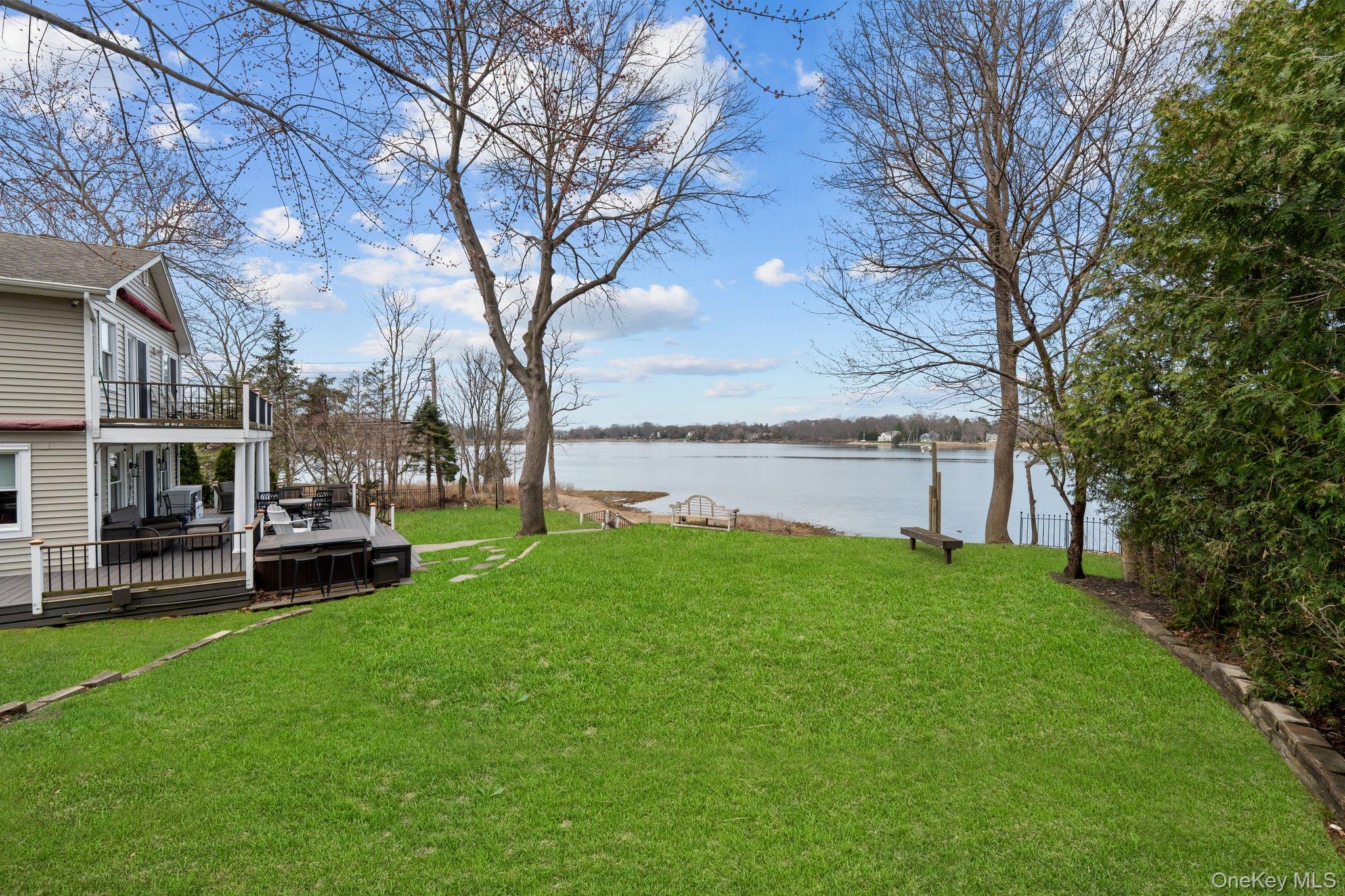 29 Dyke Road Setauket, NY 11733 - Photo 5 of 44 a house view with swimming pool and garden