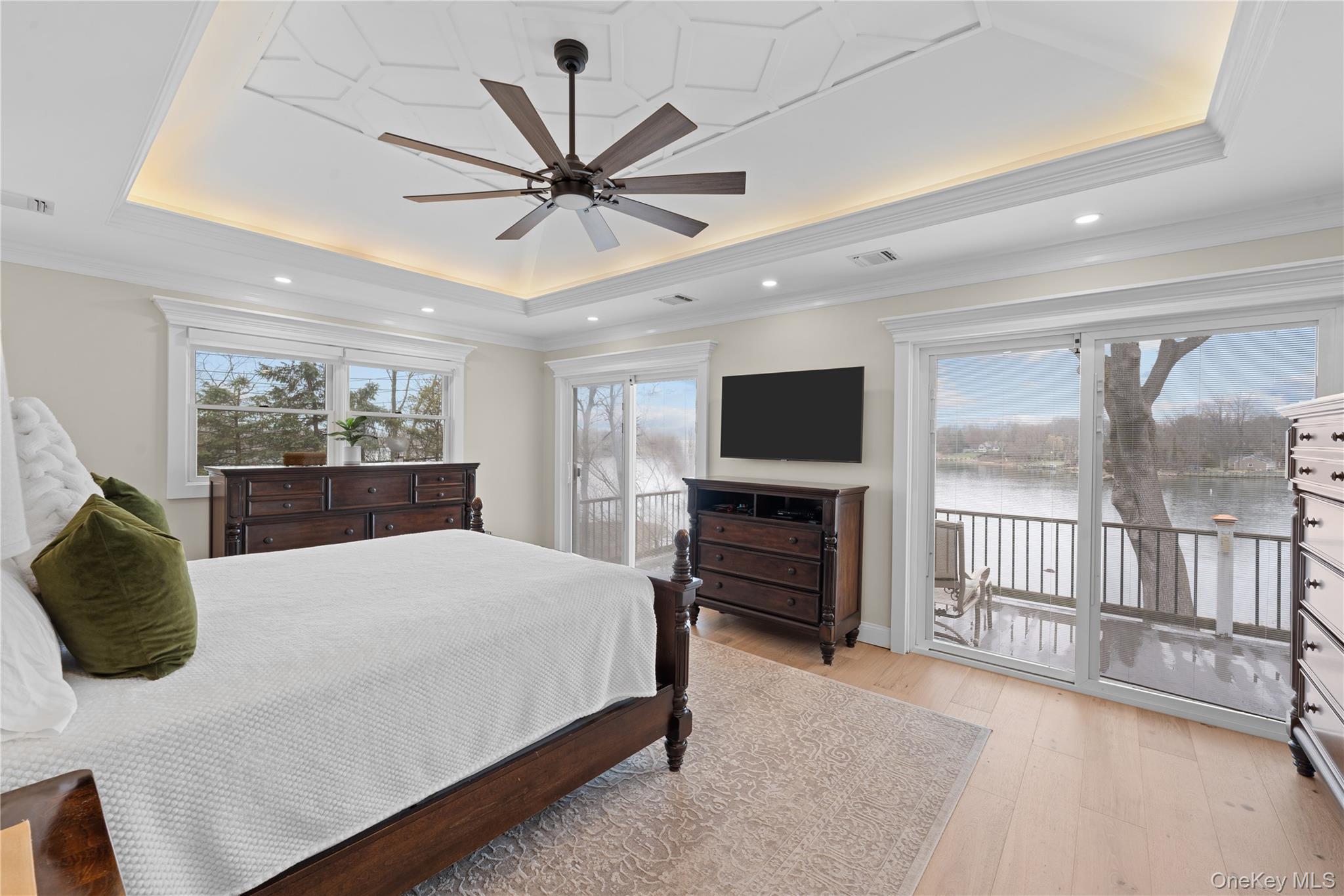 29 Dyke Road Setauket, NY 11733 - Photo 6 of 44 a bedroom with a bed and a flat screen tv