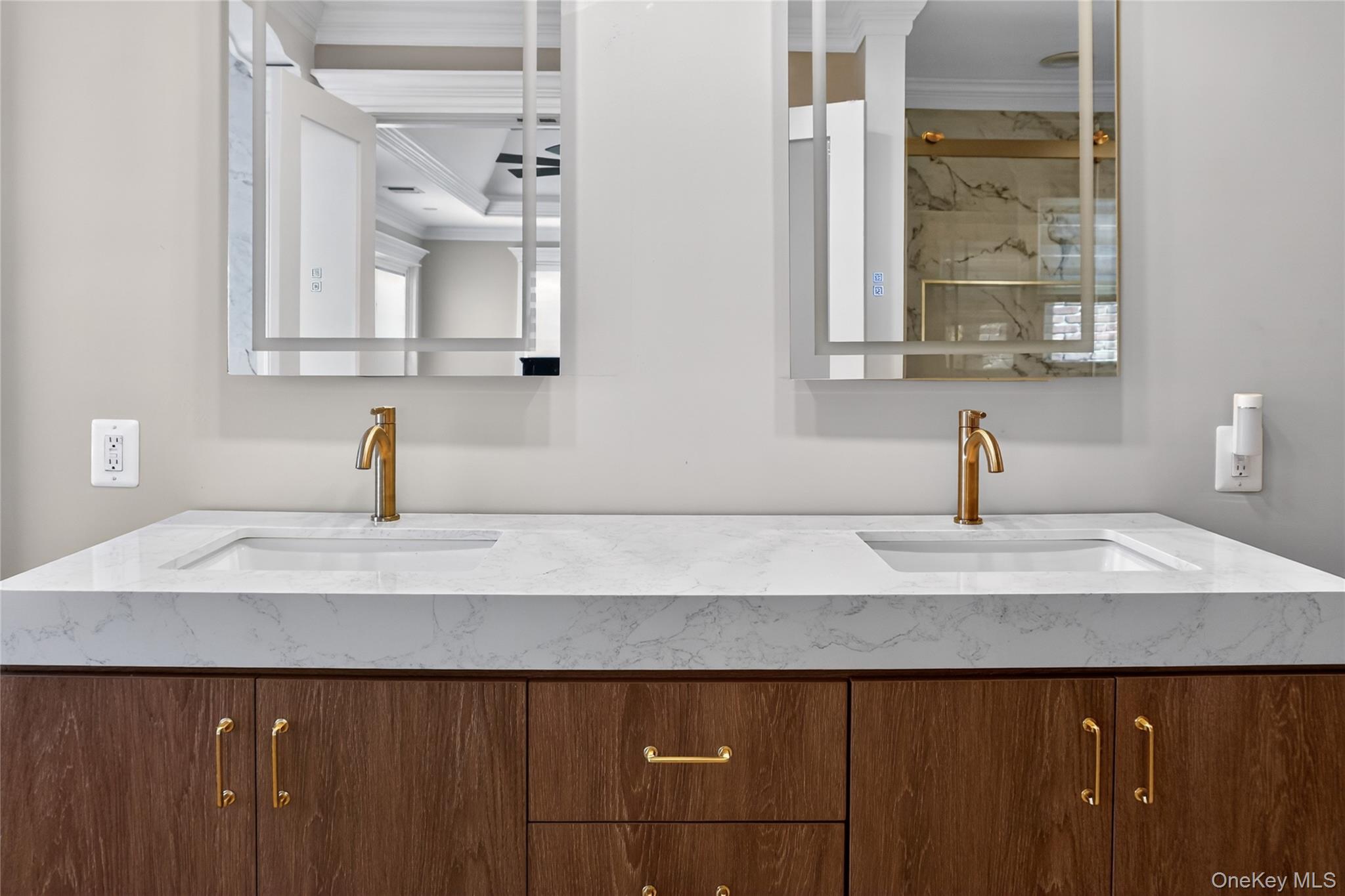 29 Dyke Road Setauket, NY 11733 - Photo 8 of 44 a bathroom with a sink and a mirror