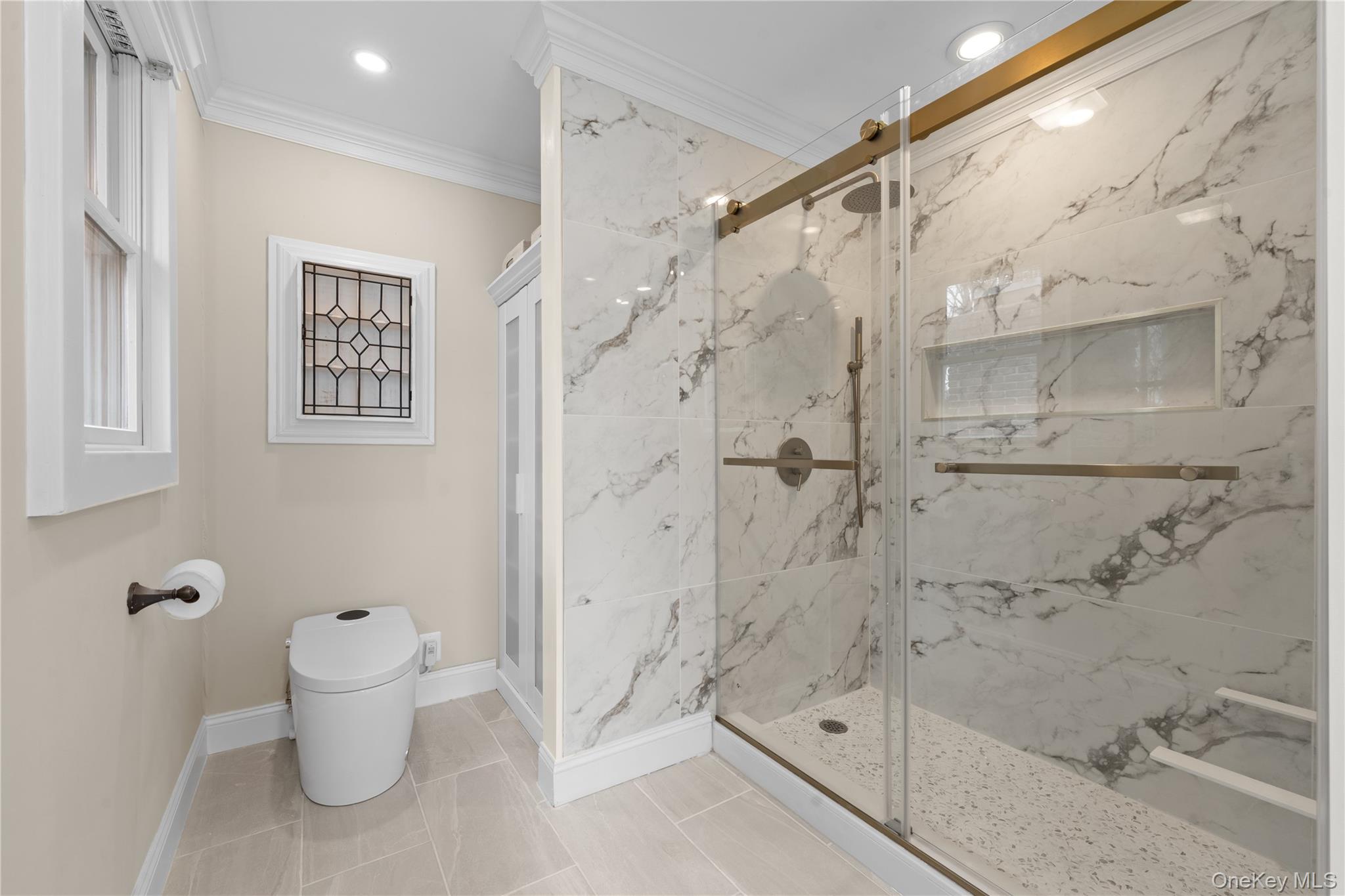 29 Dyke Road Setauket, NY 11733 - Photo 9 of 44 a bathroom with a shower and a toilet