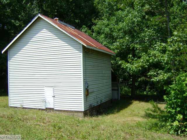 6727 Sandylea Road Oak Ridge, NC 27310 - Photo 11 of 12 Other. Workshop/barn with electric and cement floor