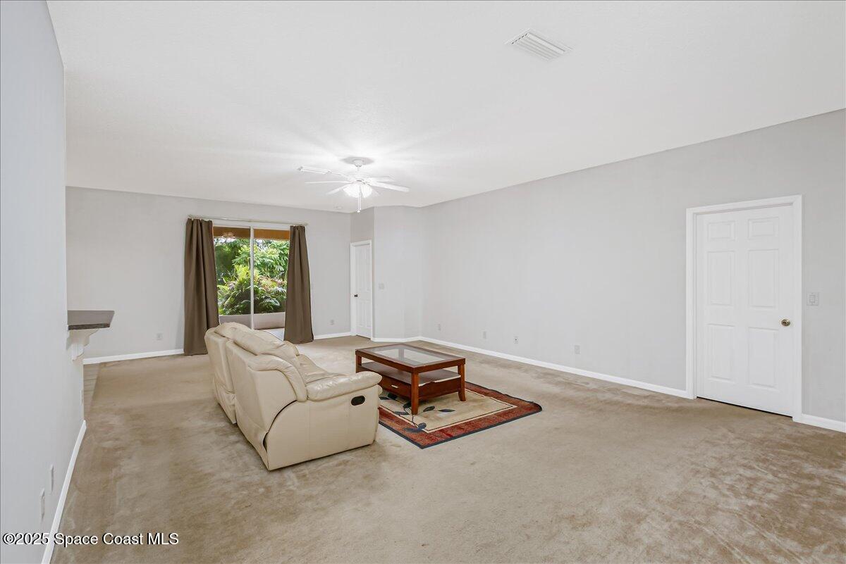 1062 Morgan Circle Northeast Palm Bay, FL 32905 - Photo 14 of 52 a room with furniture and a window