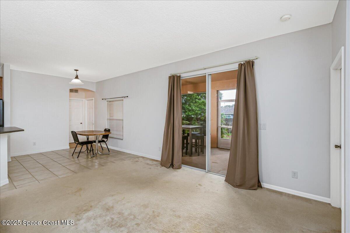 1062 Morgan Circle Northeast Palm Bay, FL 32905 - Photo 16 of 52 a view of a livingroom with furniture and a window