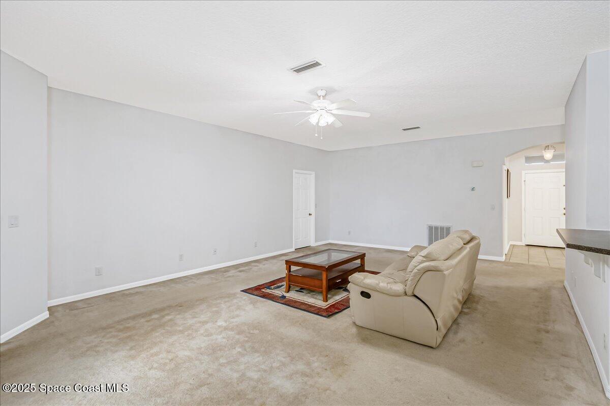 1062 Morgan Circle Northeast Palm Bay, FL 32905 - Photo 18 of 52 a living room with furniture