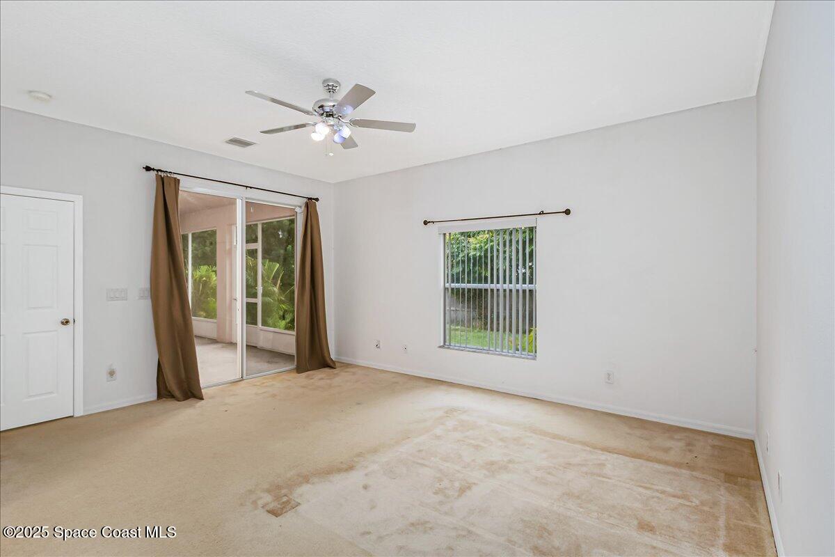 1062 Morgan Circle Northeast Palm Bay, FL 32905 - Photo 19 of 52 a view of an empty room with a window