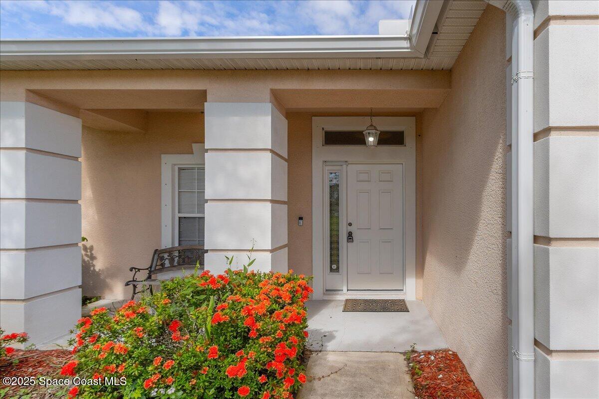 1062 Morgan Circle Northeast Palm Bay, FL 32905 - Photo 3 of 52 a front view of a house