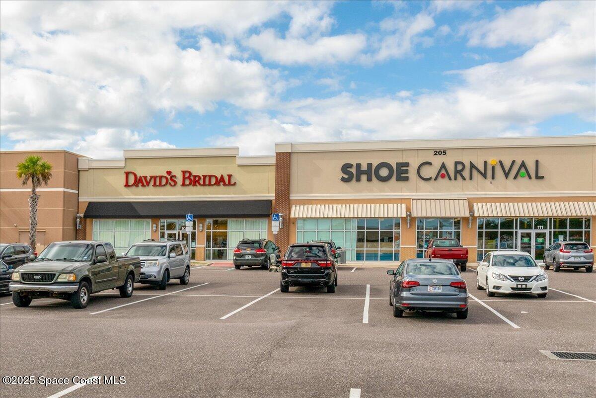 1062 Morgan Circle Northeast Palm Bay, FL 32905 - Photo 44 of 52 a car parked in front of a building