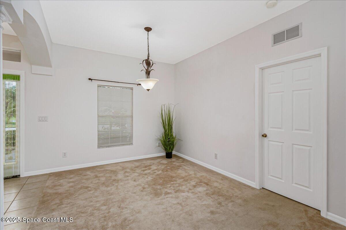 1062 Morgan Circle Northeast Palm Bay, FL 32905 - Photo 6 of 52 a view of an empty room and window
