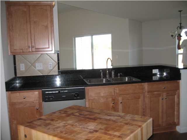 5225 Moore Loop Crestview, FL 32536 - Photo 8 of 9 a kitchen with a sink and cabinets