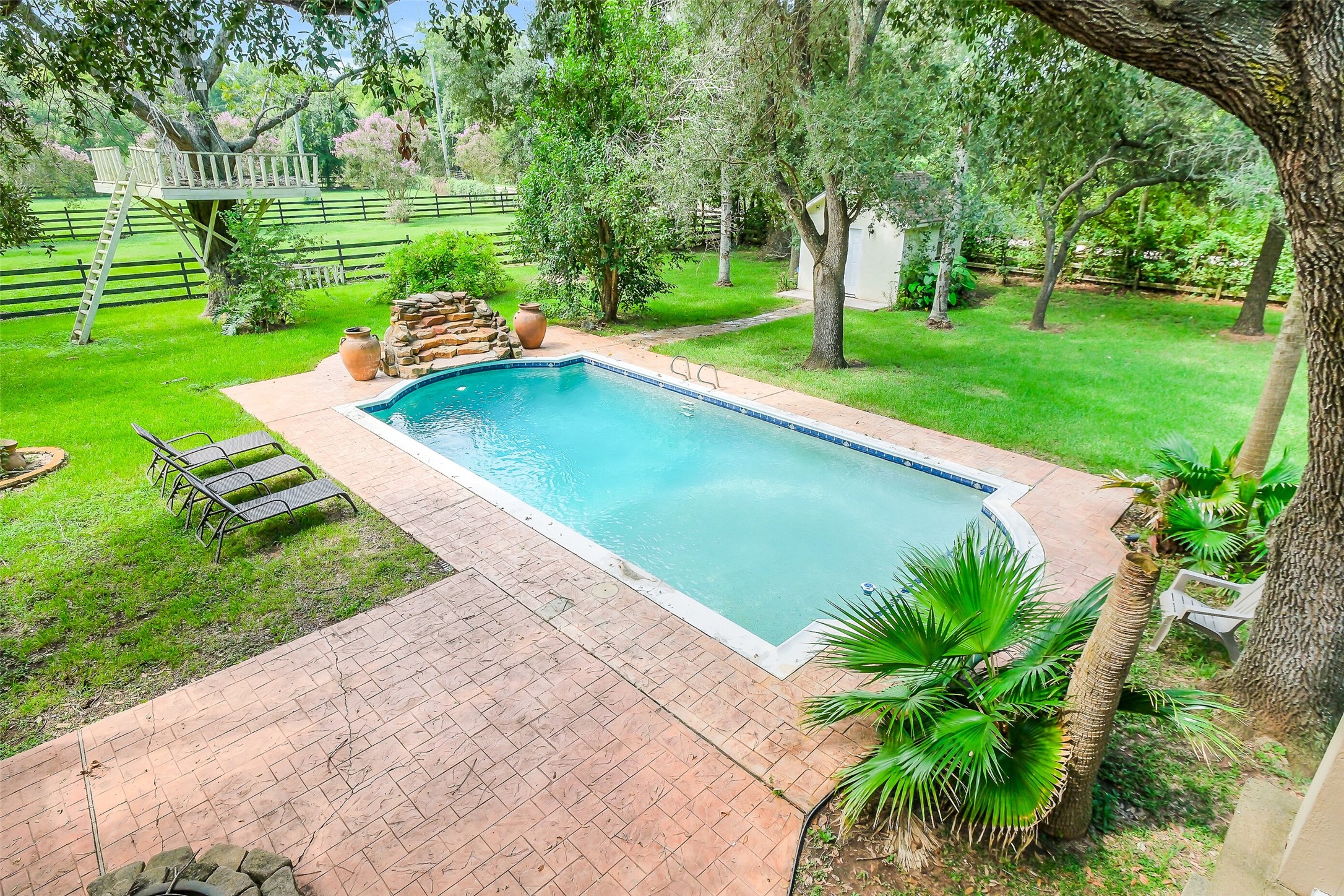 1347 Seidel Road Brookshire, TX 77423 - Photo 1 of 50 The 2nd floor has this amazing view of the pool and water feature.