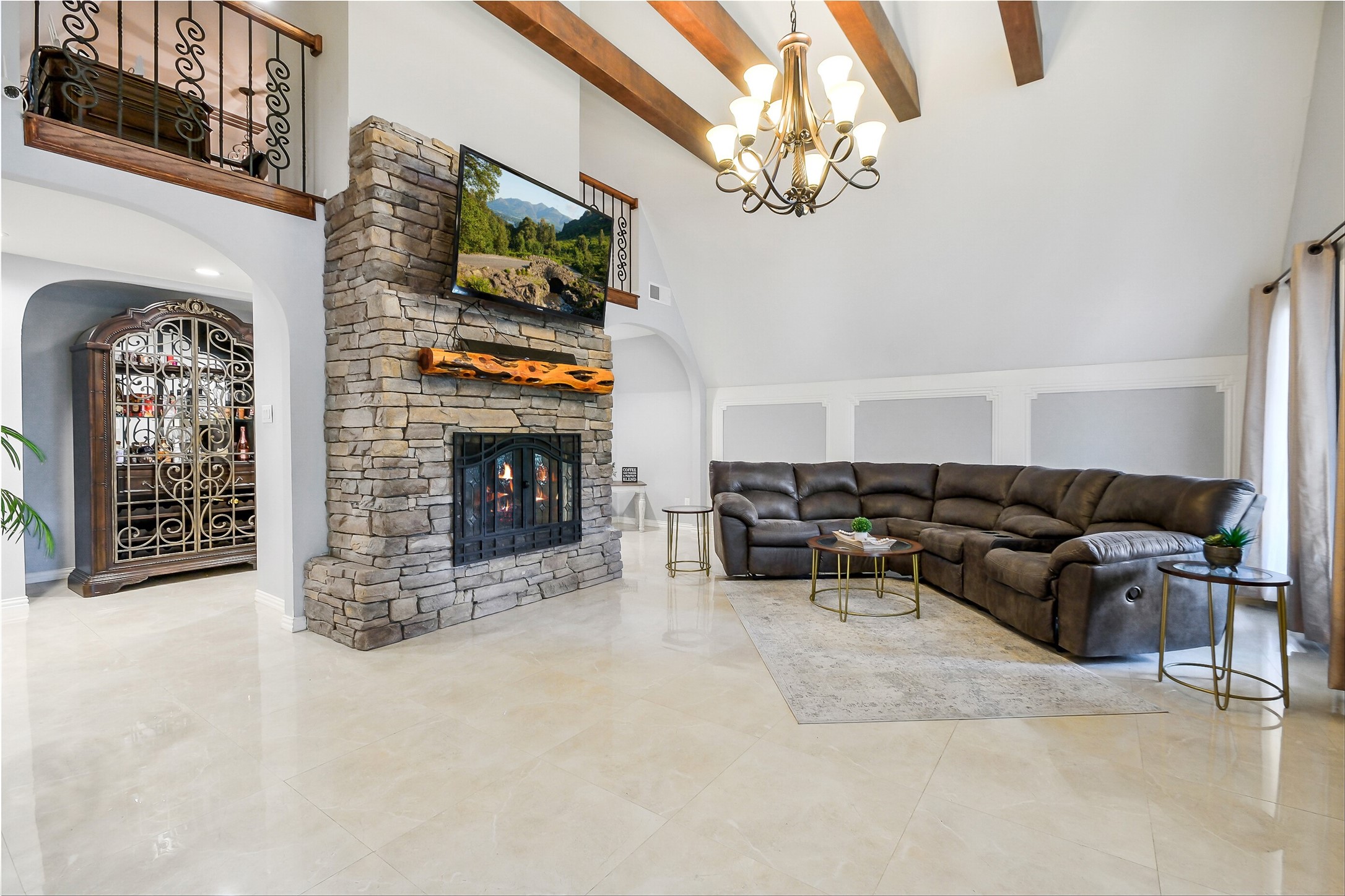 1347 Seidel Road Brookshire, TX 77423 - Photo 12 of 50 The living room has a gas fireplace and location for drinks to be displayed and poured.
