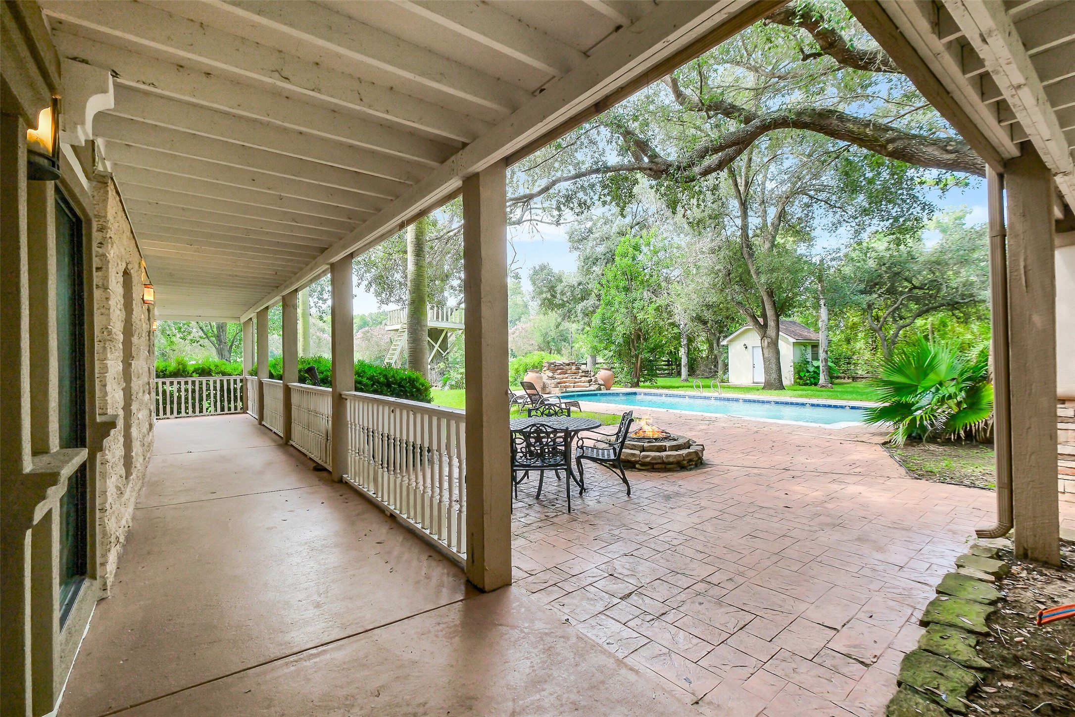 1347 Seidel Road Brookshire, TX 77423 - Photo 33 of 50 The 1st floor has this lovely verandah and seating area adjacent to the pool.