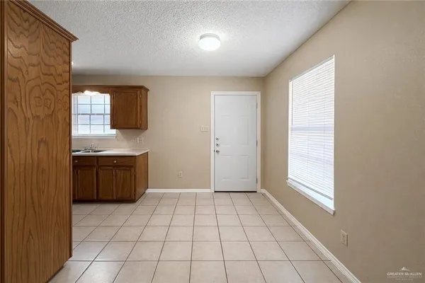 a view of a kitchen with a sink and a window