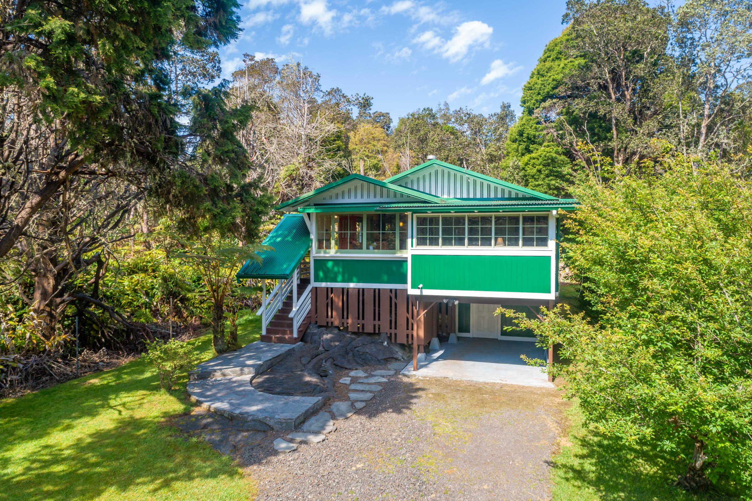 19-4035 Wright Road Volcano, HI 96785 - Photo 9 of 25 a front view of a house with a garden