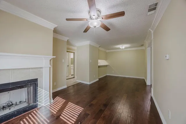 a view of a room with wooden floor