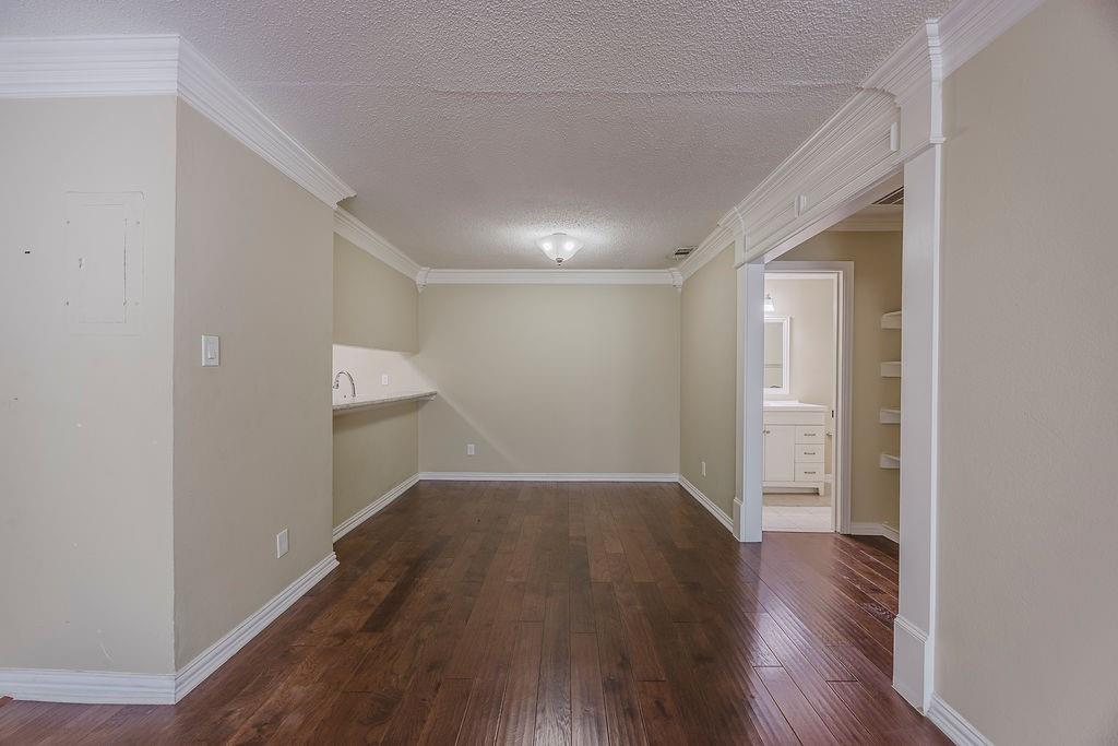2200 East Trinity Mills Road, Unit 214 Carrollton, TX 75006 - Photo 15 of 25 a view of a room with wooden floor
