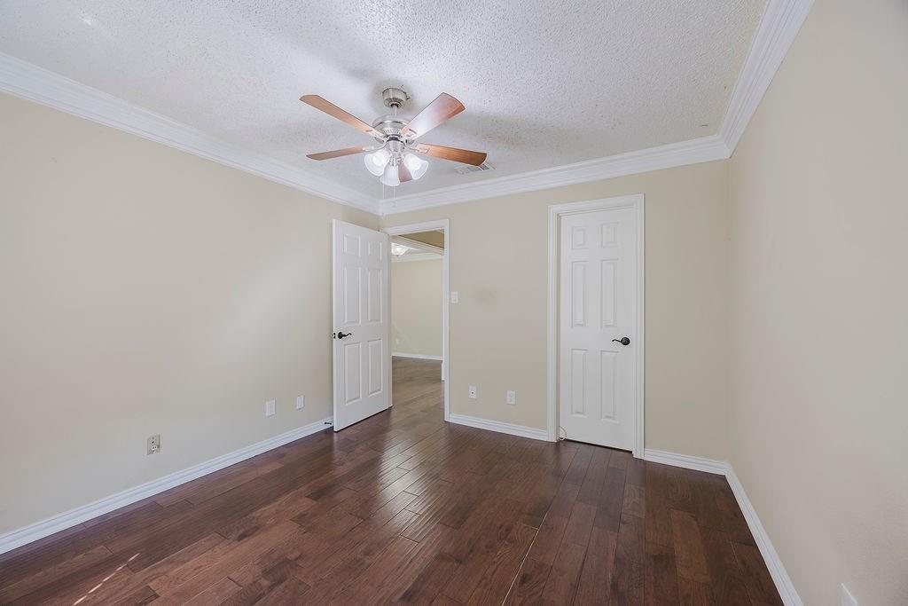 2200 East Trinity Mills Road, Unit 214 Carrollton, TX 75006 - Photo 21 of 25 a view of an empty room and wooden floor