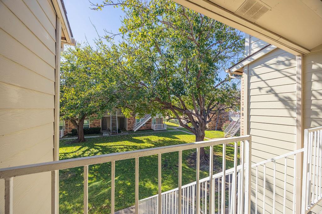 2200 East Trinity Mills Road, Unit 214 Carrollton, TX 75006 - Photo 4 of 25 a view of a house with a large window