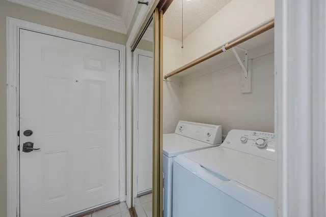 a kitchen with a sink stove and microwave