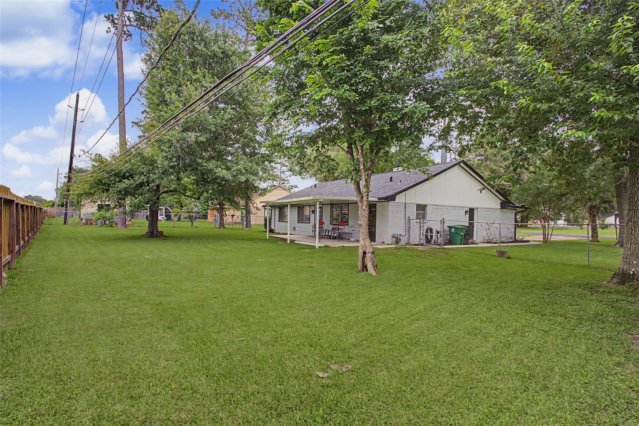 327 Fir Ridge Drive Huffman, TX 77336 - Photo 19 of 25 Large backyard with plenty of room kids and pets to play!