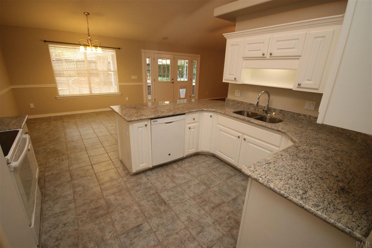 4722 Ridge Pointe Drive Pace, FL 32571 - Photo 16 of 50 Tile flooring in kitchen/ dining area.