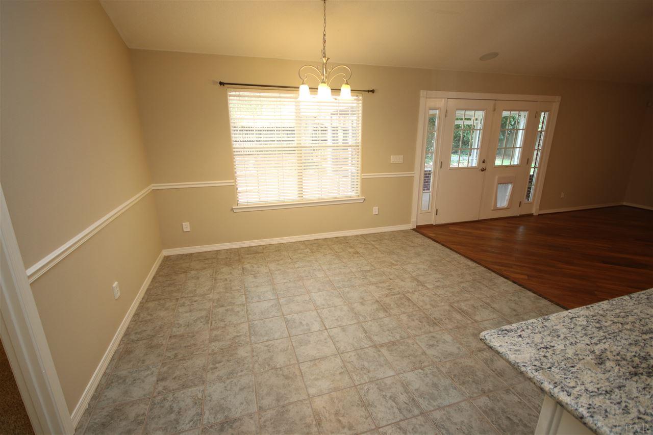 4722 Ridge Pointe Drive Pace, FL 32571 - Photo 18 of 50 21.6 x 12.6 w/ space for a large dining table.