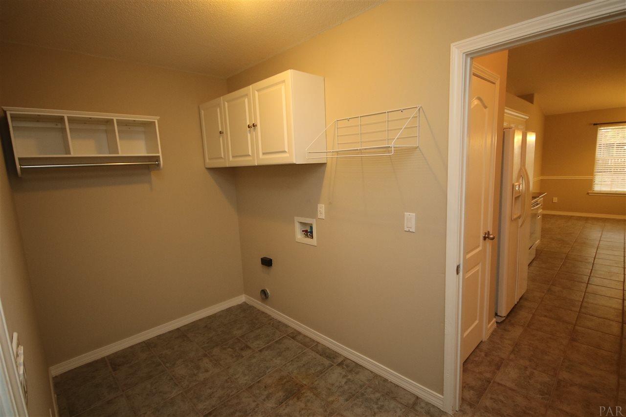 4722 Ridge Pointe Drive Pace, FL 32571 - Photo 19 of 50 cabinets & hanging space. Garage to your left.