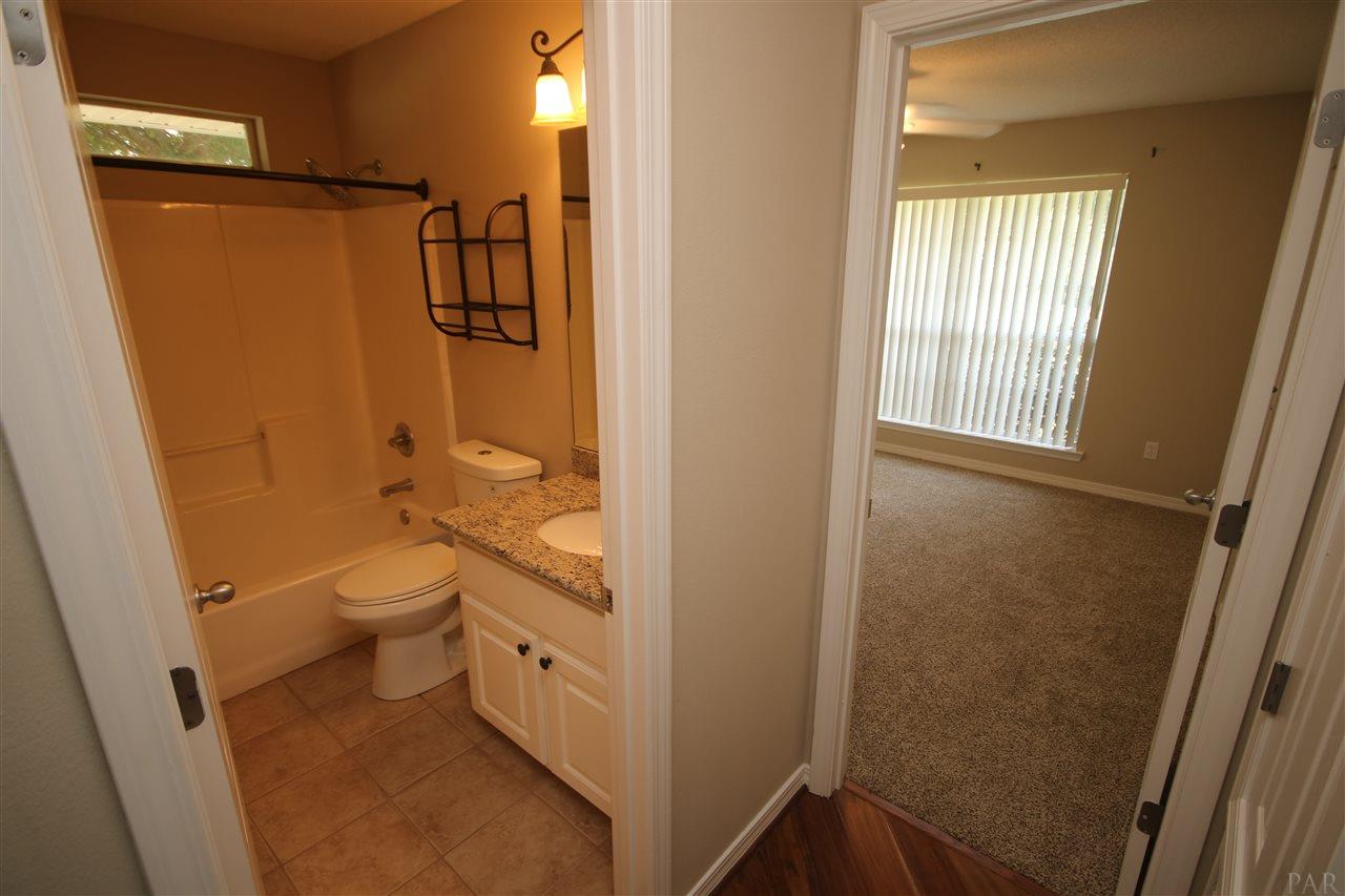 4722 Ridge Pointe Drive Pace, FL 32571 - Photo 32 of 50 to bedrooms 2 & 3. Hall has Bamboo flooring.