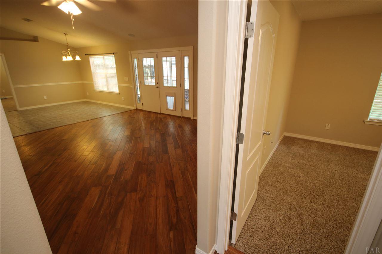 4722 Ridge Pointe Drive Pace, FL 32571 - Photo 37 of 50 3rd bedroom from hallway. Bedroom #2 to your back.