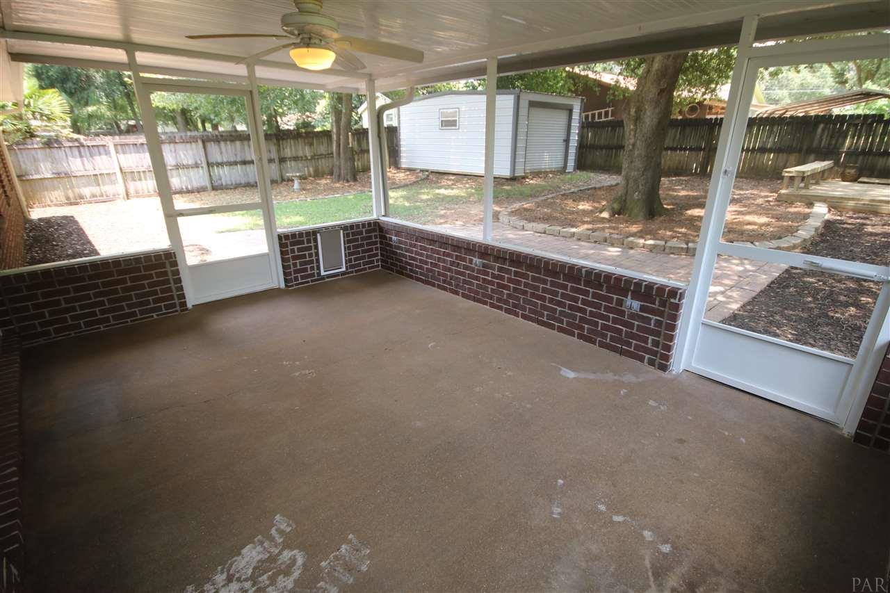 4722 Ridge Pointe Drive Pace, FL 32571 - Photo 43 of 50 with stained concrete floor & light ceiling fan.