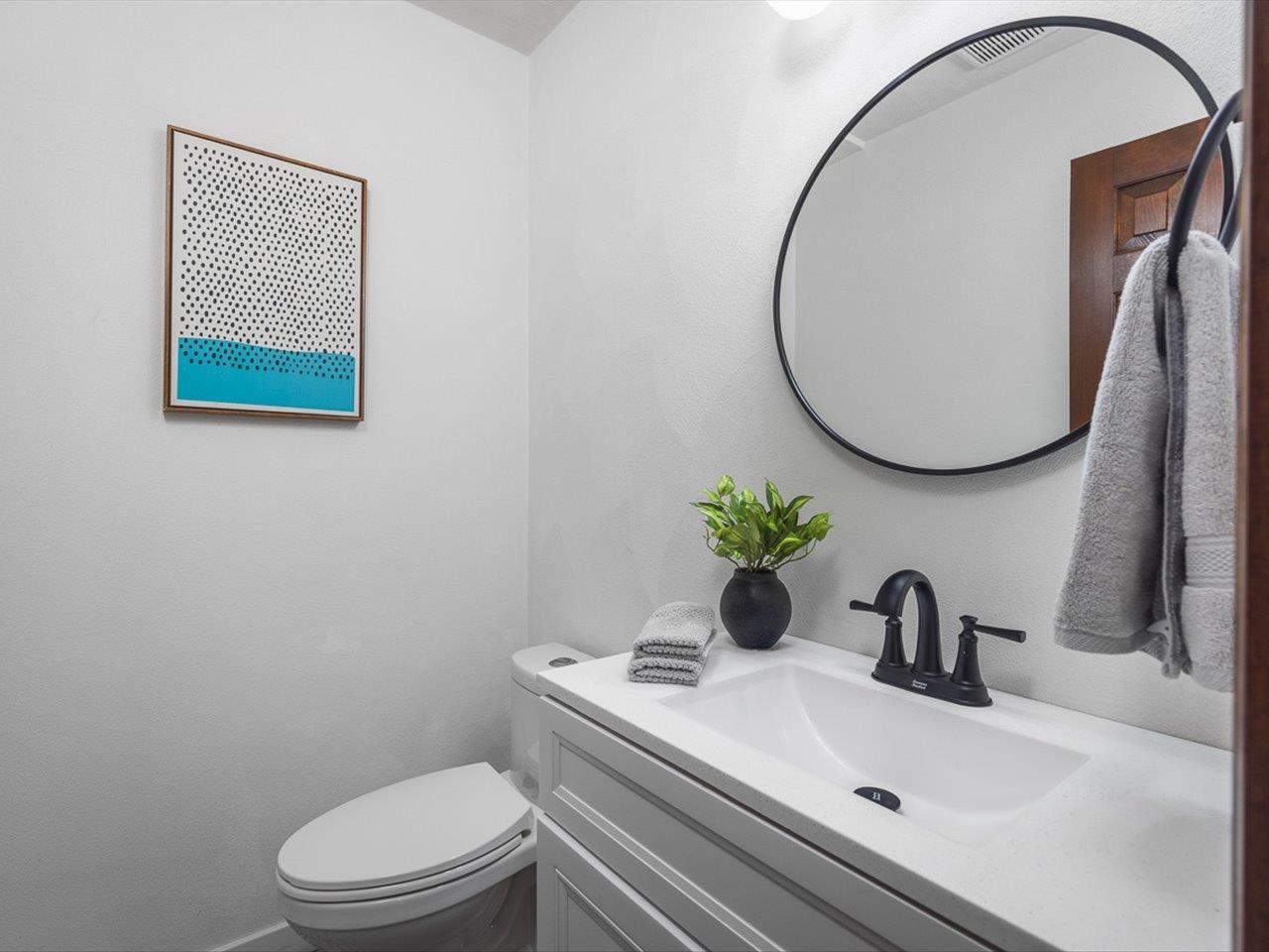 1927 Baintree Road Lake Summerset, IL 61019 - Photo 28 of 71 a bathroom with a toilet sink and mirror