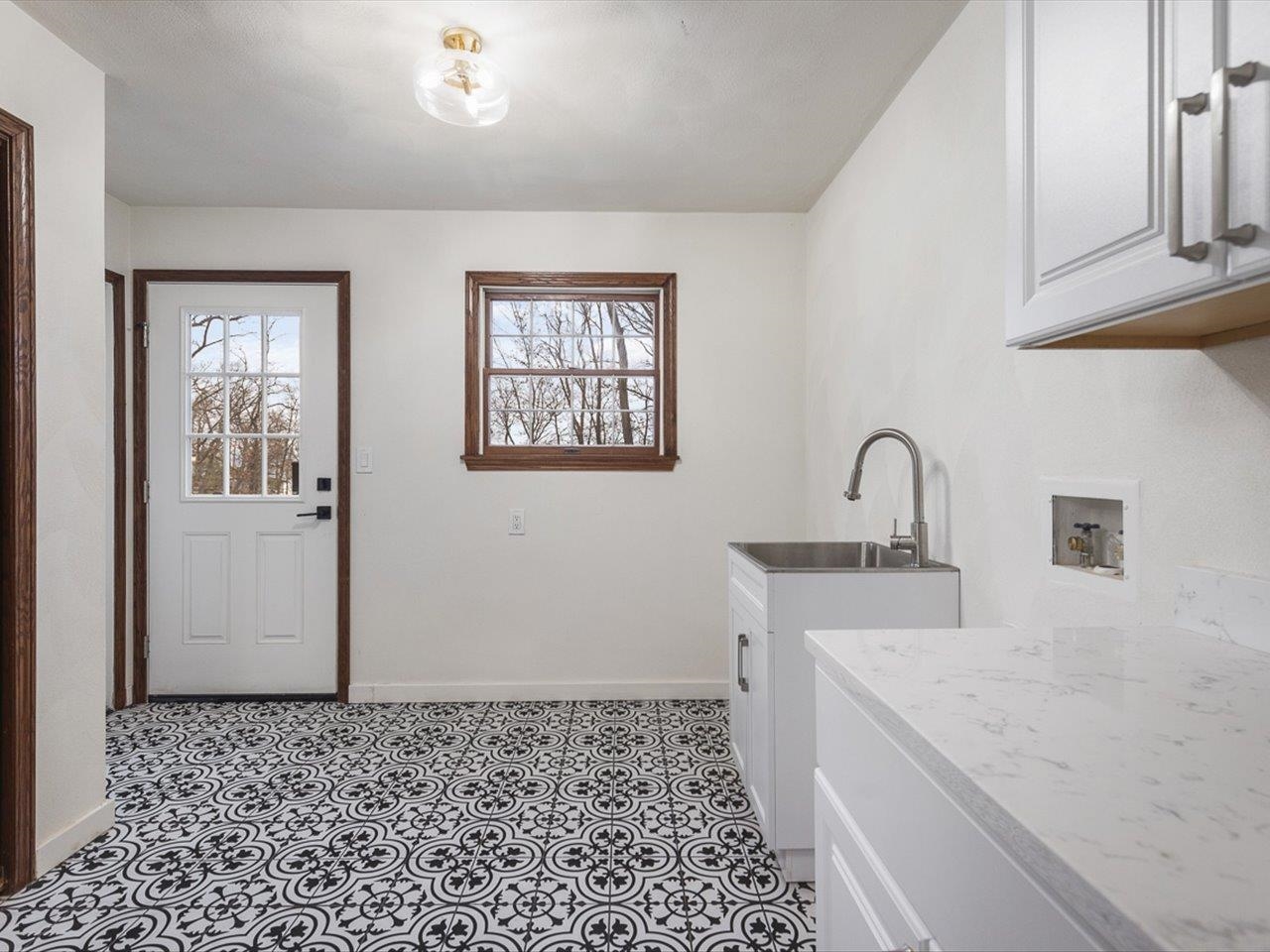 1927 Baintree Road Lake Summerset, IL 61019 - Photo 29 of 71 a kitchen with a sink and cabinets
